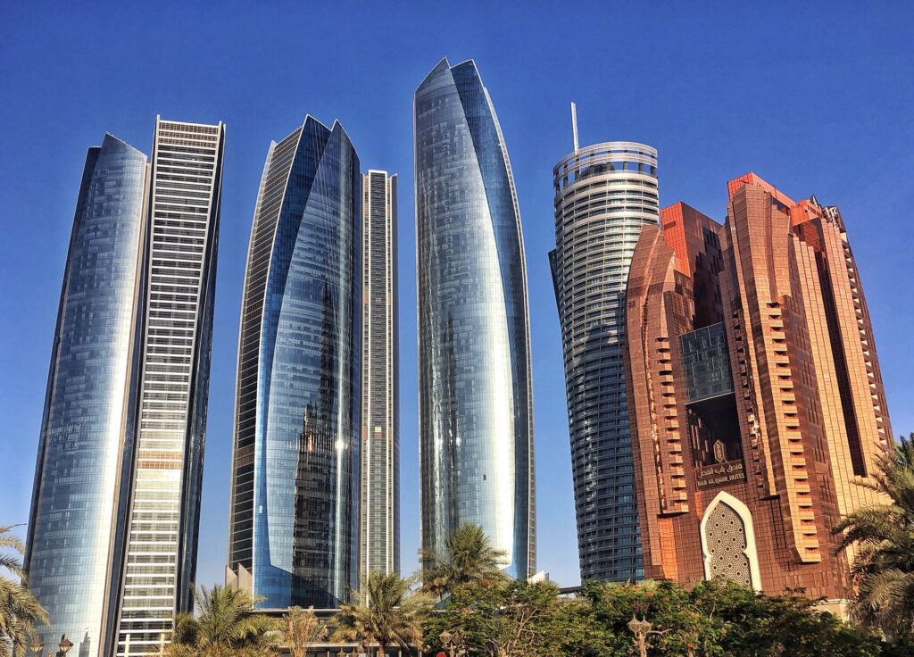 Architecture Abu Dhabi’s Etihad Towers and adjacent buildings reflect the late afternoon hot